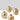 Set of three gold metallic vases on a white surface with a light gray background